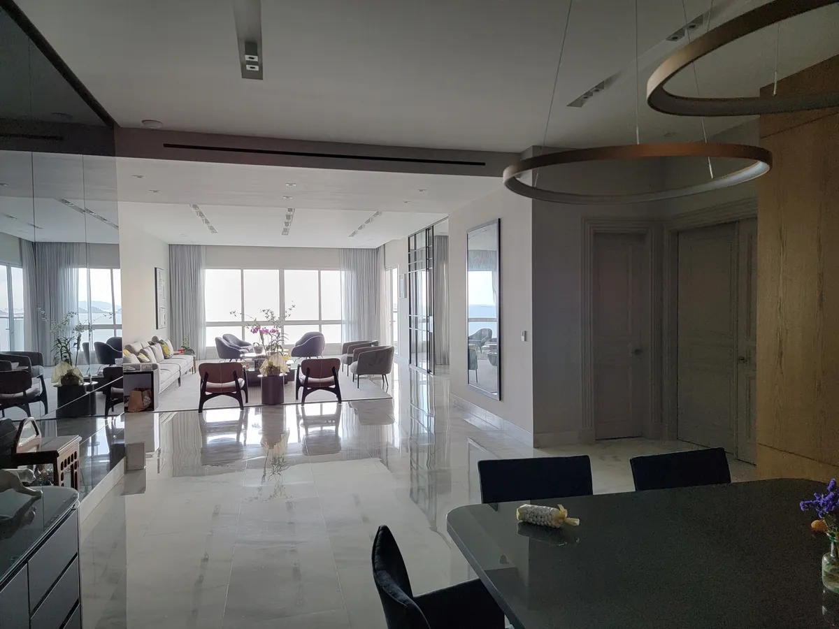 Living and dining area of an apartment where the ducted air conditioning stays out of sight