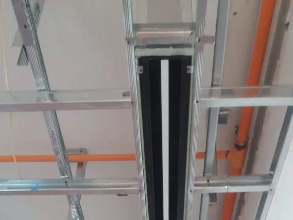 Ducted system going in: ceiling framing and the linear diffuser before the ceiling is closed